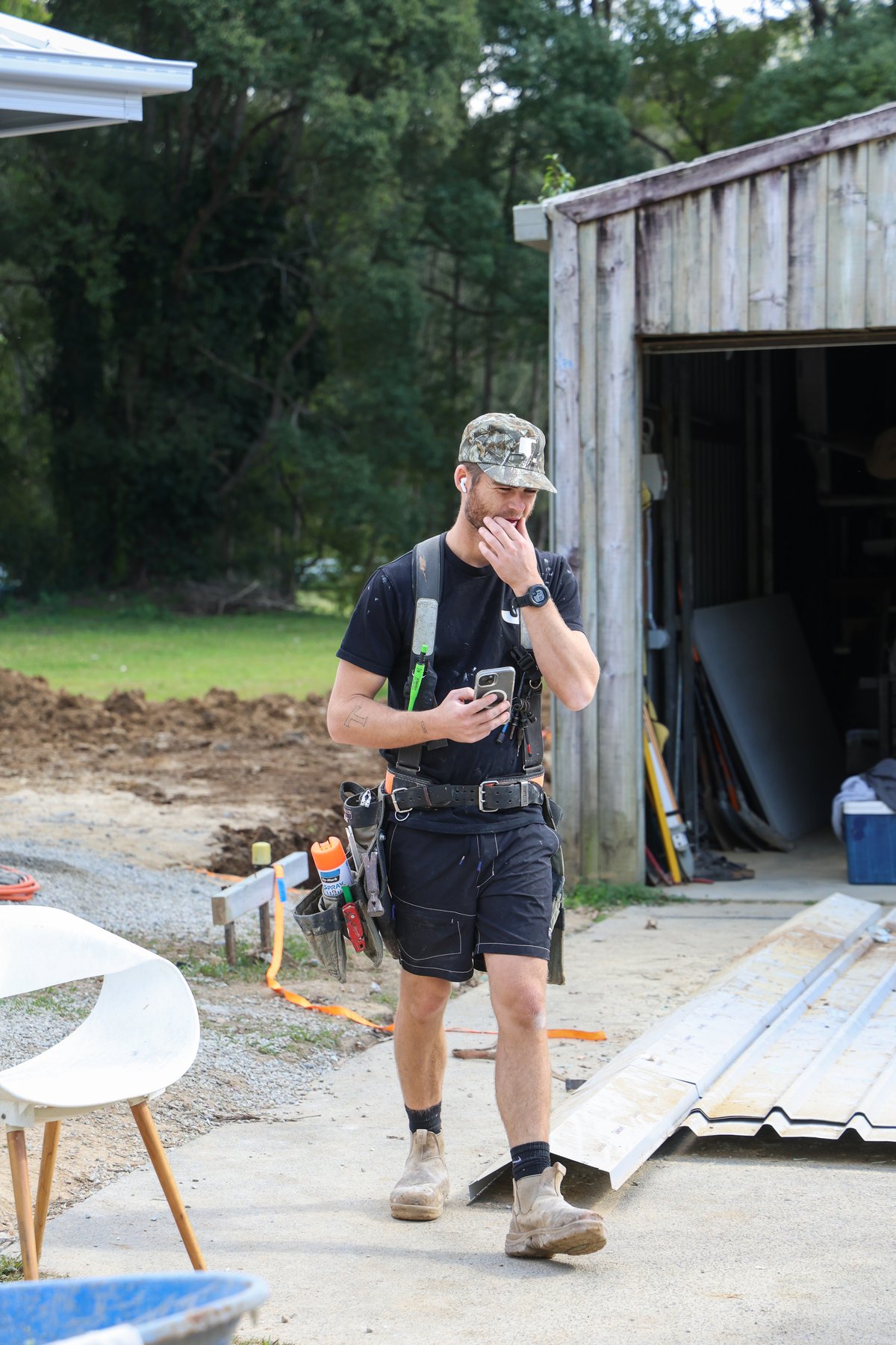 A Jace Space tradesperson on site, tool belt on, between tasks