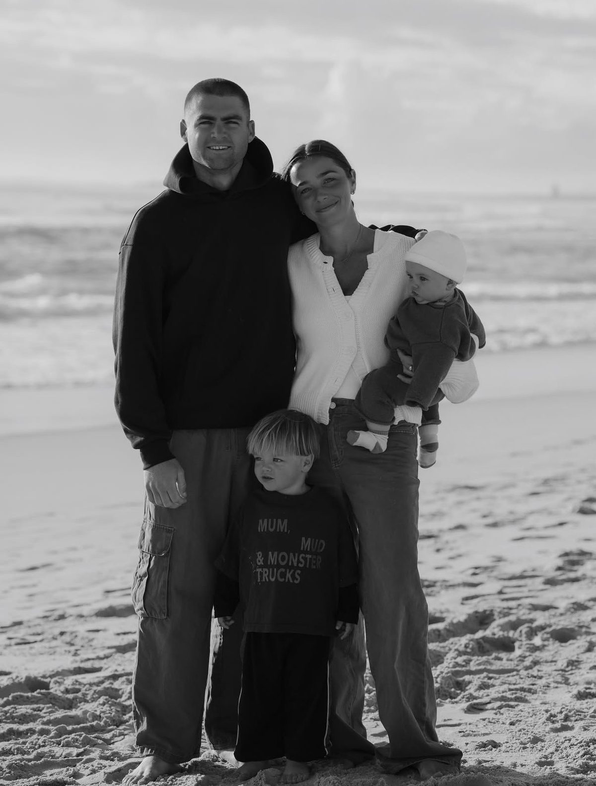 Téa and Declan with their two children on the beach